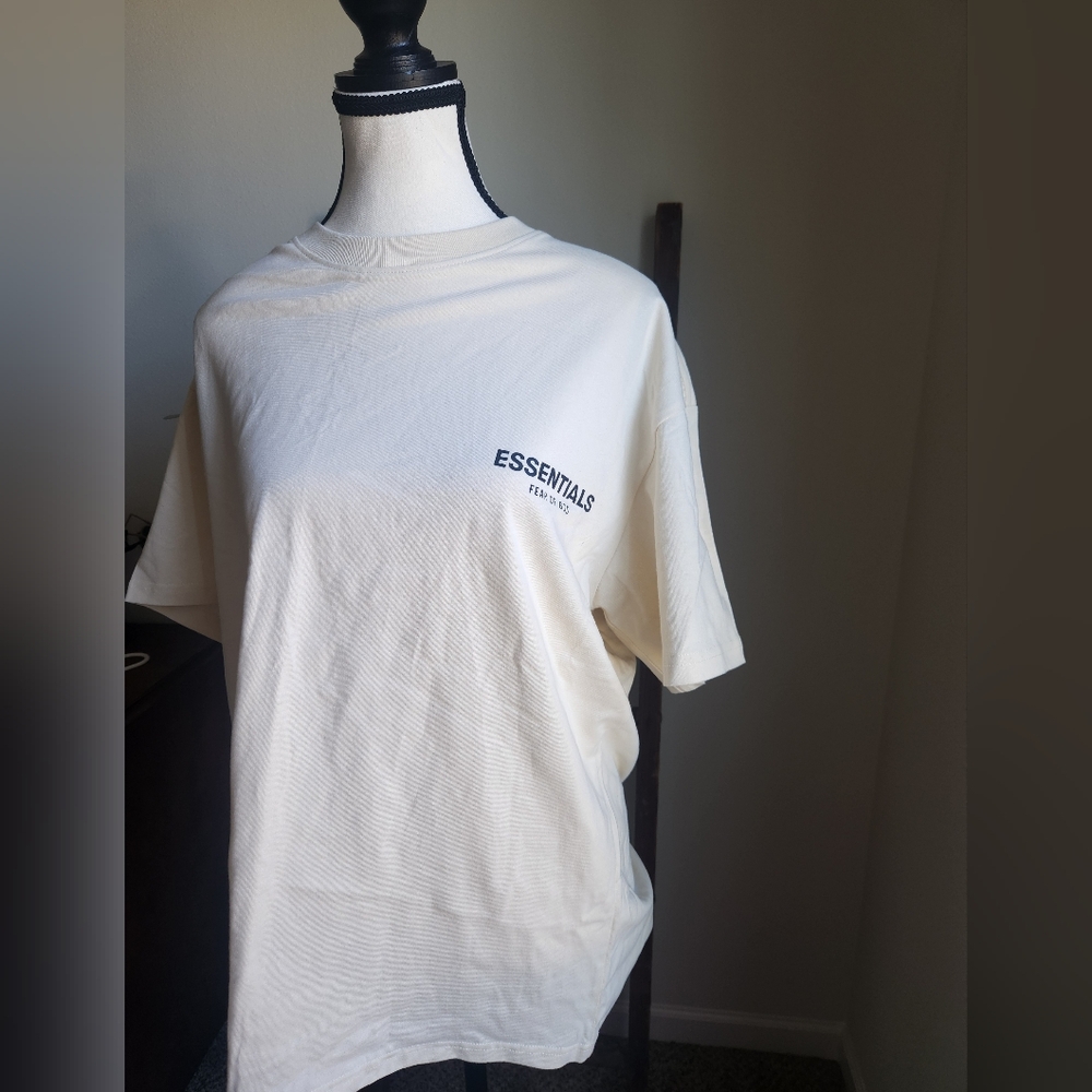 Fear of God Essentials Cream Short Sleeve Tee with Black Logo